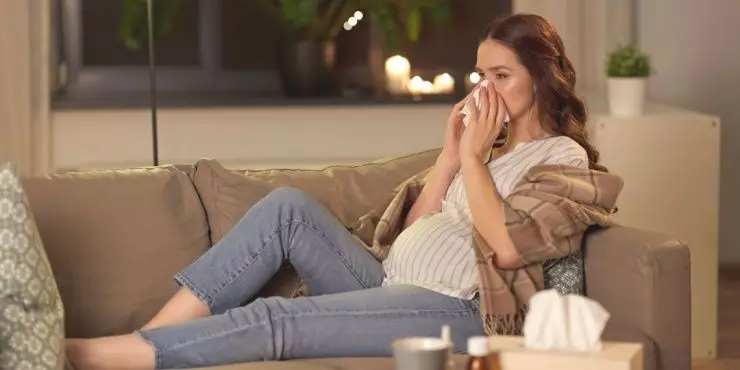 evening-cold-symptoms-pregnancy-on-sofa.jpg